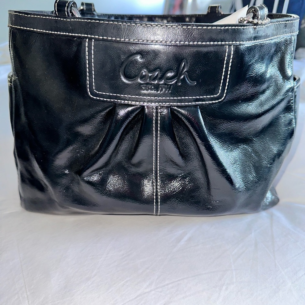 Coach shoulder bag, black purple inside still looks good